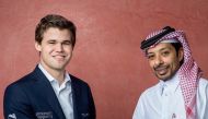 QCF President Mohammed Al Madhahka with Norway’s Magnus Carlsen. 