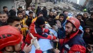 Rescue workers and volunteers pull out a survivor from the rubble in Diyarbakir on February 6, 2023, after a 7.8-magnitude earthquake struck the country's south-east. (Photo by ILYAS AKENGIN / AFP)