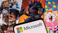 Microsoft logo is seen on a smartphone placed on displayed Activision Blizzard's games characters in this illustration taken January 18, 2022. (REUTERS/Dado Ruvic/Illustration)