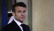 France's President Emmanuel Macron waits for Ethiopian Prime Minister before a meeting at the Elysee Presidential Palace in Paris on February 7, 2023. (Photo by Ludovic MARIN / AFP)