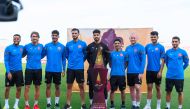 Al Duhail players pose with the Qatar Cup trophy.