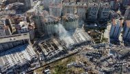 This aerial view shows collapsed buildings in Hatay, southeastern Turkey, on February 8, 2023, two days after a strong earthquake struck the region. Photo by DHA (Demiroren News Agency) / AFP)