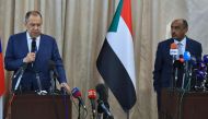 Russian Foreign Minister Sergei Lavrov (L) and Sudanese acting foreign minister Ali al-Sadiq (R) give a joint press conference at the airport in Khartoum on February 9, 2023 during an official visit to Sudan. (Photo by ASHRAF SHAZLY / AFP)
