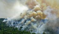 In this file photo taken on August 16, 2020, shows an aerial view of a burning area of Amazon rainforest reserve, south of Novo Progresso in Para State, Brazil. - Deforestation in the Brazilian Amazon fell 61% in January 2023, the first month of the government of President Luiz Inلcio Lula da Silva, compared to the same period in 2022, according to an official report published on February 10, 2023. (Photo by CARL DE SOUZA / AFP)
 