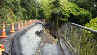 A general view of a damaged road after a storm battered Titirangi, a suburb of New Zealand's West Auckland area, on February 13, 2023. Photo by Diego OPATOWSKI / AFP