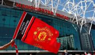FILE PHOTO: Soccer Football - Premier League - Manchester United v Crystal Palace - Old Trafford, Manchester, Britain - August 24, 2019 General view as Manchester United fans wave a flag outside the stadium before the match Action Images via Reuters/Paul Childs
