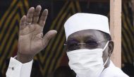 In this file photo taken on April 11, 2021 Chadian President Idriss Deby Itno greets a crowd of journalists and supporters as he arrives to casts his ballot at a polling station in N'djamena.(Photo by MARCO LONGARI / AFP)