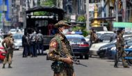 A soldier stands guard along a road as security forces search for protesters in Yangon on May 7, 2021. File photo / AFP
