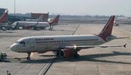 This file photo taken on January 20, 2023 shows an Air India aircraft on the tarmac at the Indira Gandhi International airport in New Delhi. - Air India will buy 250 aircraft from Airbus in a deal aimed at transforming the former national carrier and expanding its operations, chairman announced on February 14, 2023. (Photo by Sajjad HUSSAIN / AFP)