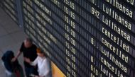 In this file photo taken on September 2, 2022 a display announces cancelled flights in the Lufthansa terminal of the Franz-Josef-Strauss airport in Munich, southern Germany, as pilots called for a strike affecting the Lufthansa passenger airline and Lufthansa Cargo after pay negotiations with the German airline collapsed. Photo by Christof STACHE / AFP