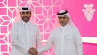 QREC Chairman Issa bin Mohammed Al Mohannadi and CEO of Al Emadi Real Estate Enterprises Company and Al Hazm Mohammed Abdul Karim Al Emadi after the press conference yesterday. PIC: Juhaim/QREC 