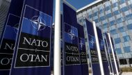 Banners displaying the NATO logo are placed at the entrance of new NATO headquarters during the move to the new building, in Brussels, Belgium April 19, 2018. REUTERS/Yves Herman/File Photo
