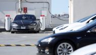 Tesla cars recharge at a Tesla Supercharger station on February 15, 2023 in San Francisco, California. Electric car company Tesla is partnering with the U.S. federal government to expand electric vehicle charging infrastructure in the United States.  Justin Sullivan/Getty Images/AFP 
