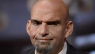 (FILES) In this file photo taken on January 3, 2023 US Democratic Senator from Pennsylvania John fetterman looks on as he is ceremonially sworn in by Vice President Kamala Harris for the 118th Congress in the Old Senate Chamber at the US Capitol in Washington, DC. (Photo by OLIVIER DOULIERY / AFP)
