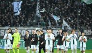 Borussia Moenchengladbach's team celebrates after the German first division Bundesliga match between Borussia Moenchengladbach vs Bayern Munich in Moenchengladbach, western Germany, on February 18, 2023. (Photo by INA FASSBENDER / AFP)