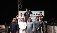  Qatar Boxing Federation President Sheikh Fahd bin Khalid Al Thani and  other officials pose with podium winners during the presentation ceremony.