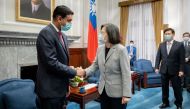 This handout picture taken and released by Taiwan Presidential Office on February 21, 2023 shows Taiwan President Tsai Ing-wen (C) shaking hands with US Representative Ro Khanna at the Presidential Office in Taipei. (Photo by Handout / TAIWAN PRESIDENTIAL OFFICE / AFP)