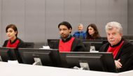 Lawyers Jean-Louis Gilissen (R), Leto Cariolou (L) and Hedi Aouini (C) attend the start of the trial of former Kosovo Liberation Army (KLA) member, Pjeter Shala, also known as 