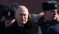 Russian President Vladimir Putin attends a wreath-laying ceremony at the Eternal Flame and the Unknown Soldier's Grave in the Alexander Garden during an event marking Defender of the Fatherland Day in Moscow on February 23, 2023. (Photo by Mikhail Metzel / AFP)