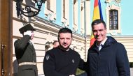In this handout image released by La Moncloa on February 23, 2023 Spanish Prime Minister Pedro Sanchez shakes hands with Ukrainian President Volodymyr Zelensky, during his visit to Kiev, in Ukraine.  (Photo by Borja Puig de la BELLACASA / LA MONCLOA / AFP) 