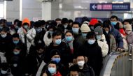 File Photo: People wearing face masks commute in a subway station during morning rush hour, following the coronavirus disease ( COVID-19) outbreak, in Beijing, China January 20, 2021. (REUTERS/Tingshu Wang)