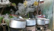 File Photo: Women sit next to their cooking stoves at the sprawling Kibera slums in Kenya's capital Nairobi, June 8, 2009. (Reuters/Noor Khamis)