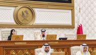Speaker of the Shura Council H E Hassan bin Abdullah Al Ghanim (top right) chairing the regular weekly meeting yesterday.