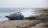 A photograph taken on February 28, 2023 shows parts of a migrants boat, washed on the beach, two day after it sank off Italy's southern Calabria region, in Steccato di Cutro, south of Crotone. (Photo by Alessandro SERRANO / AFP)
