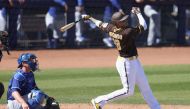 PEORIA, ARIZONA - FEBRUARY 27: Manny Machado #13 of the San Diego Padres hits a single against the Los Angeles Dodgers during the third inning of the spring training game at Peoria Stadium on February 27, 2023 in Peoria, Arizona. Christian Petersen/Getty Images/AFP