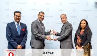 Ramy Boctor (second from left), Chief Technology Officer and Mahday Al Hebabi, Enterprise Business Director receives the award.