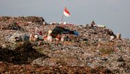 Indonesian national flag is seen at the Bantar Gebang landfill in Bekasi, West Java province, Indonesia.