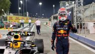 Red Bull Racing's Dutch driver Max Verstappen gives the thumbs-up gesture as he walks by his car in the pit lane during the qualifying round of the Bahrain Formula One Grand Prix at the Bahrain International Circuit in Sakhir on March 4, 2023. (Photo by Giuseppe CACACE / AFP)