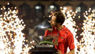 Russia's Daniil Medvedev kisses his trophy after winning against Andrey Rublev during the ATP Dubai Duty Free Tennis Championship final match in Dubai, on March 4, 2023. (Photo by Karim SAHIB / AFP)