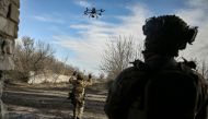 A Ukrainian serviceman flies a drone to spot Russian positions near the city of Bakhmut, in the region of Donbas, on March 5, 2023. (Photo by Aris Messinis / AFP)
