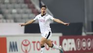 Baghdad Bounedjah celebrates after scoring Al Sadd’s first goal.