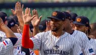 Netherlands' Xander Bogaerts (C) celebrates with teammates after victory during the World Baseball Classic game between Cuba and the Netherlands at Taichung Intercontinental Baseball Stadium in Taichung on March 8, 2023. (Photo by Sam Yeh / AFP)