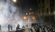 Protesters clash with police in Tbilisi late on March 8, 2023. (Photo by Zurab Tsertsvadze / AFP)
 