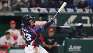 Czech Republic's Matej Mensik hits a double during the World Baseball Classic (WBC) Pool B round game between Czech Republic and China at the Tokyo Dome in Tokyo on March 10, 2023. (Photo by Kazuhiro NOGI / AFP)