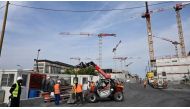 Workers operate at the site of the 2024 Olympic and Paralympic Games athletes' village in Saint-Ouen, outside Paris, on 30 August, 2022. File photo / AFP