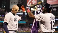 Trayce Thompson #43 of Team Great Britain is congratulated by Chavez Young #12 after hitting a solo home run against Team USA during the first inning of the World Baseball Classic Pool C game at Chase Field on March 11, 2023 in Phoenix, Arizona. Christian Petersen/Getty Images/AFP (Photo by Christian Petersen / GETTY IMAGES NORTH AMERICA / Getty Images via AFP)