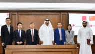 QC First Vice-Chairman Mohamed bin Ahmed bin Twar Al Kuwari (centre) and CFTC’s President Chu Shijia (third left) with other officials of both institutions after signing the agreement.