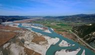 An aerial view taken on March 14, 2023, shows Vjosa, one of the last wild rivers in Europe, at her natural flow, near the city of Fier. (Photo by ADNAN BECI / AFP)

