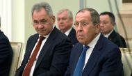 Russian Defence Minister Sergei Shoigu (left) and Foreign Minister Sergei Lavrov attend a meeting of Russia's President Vladimir Putin with his Syrian counterpart Bashar al-Assad (both not pictured) at the Kremlin in Moscow on March 15, 2023. (Photo by Vladimir GERDO / SPUTNIK / AFP)