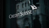 A sign of Credit Suisse bank is seen on the branch building in Geneva, on March 15, 2023. - Credit Suisse shares nosedived on March 15, 2023, after its main shareholder said it would not provide more funding, with reassuring comments from the Swiss bank's chairman unable to calm the market panic. (Photo by Fabrice COFFRINI / AFP)