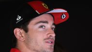 Ferrari's Monegasque driver Charles Leclerc speaks to reporters in the paddock at the Jeddah Corniche Circuit on March 16, 2023, ahead of the 2023 Saudi Arabia Formula One Grand Prix. (Photo by Giuseppe Cacace / AFP)