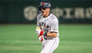 Japan's Lars Nootbaar reacts after hitting a single during the World Baseball Classic (WBC) quarter-final game between Japan and Italy at the Tokyo Dome in Tokyo on March 16, 2023. (Photo by Yuichi YAMAZAKI / AFP)
