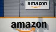 In this file photo taken on April 16, 2020 A picture shows the Amazon logo at the entrance area of the Amazon logistics centre in Lauwin-Planque, northern France, on April 16, 2020.  (Photo by DENIS CHARLET / AFP)
