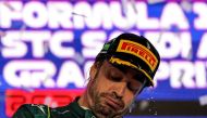 Aston Martin's Spanish driver Fernando Alonso reacts on the podium at the end of the Saudi Arabia Formula One Grand Prix at the Jeddah Corniche Circuit in Jeddah on March 19, 2023. Photo by Giuseppe CACACE / AFP