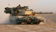 In this photograph taken on March 18, 2003 a US M1A1 Abrams tank from the US Army 3rd Infantry Division in the northern Kuwait desert advances close to Iraq. - The United States will deliver Abrams tanks to Ukraine by the fall of 2023 -- significantly faster than expected -- while Patriot air defenses will also arrive on an 