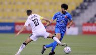 Al Duhail's Ferjani Sassi in action against Al Sadd captain Hassan Al Haydos during their semi-final.